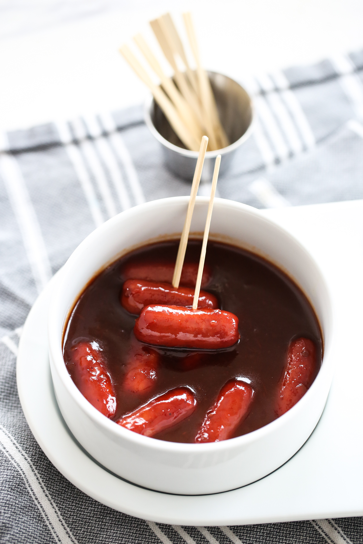 sweet and sour little smokies in a serving dish