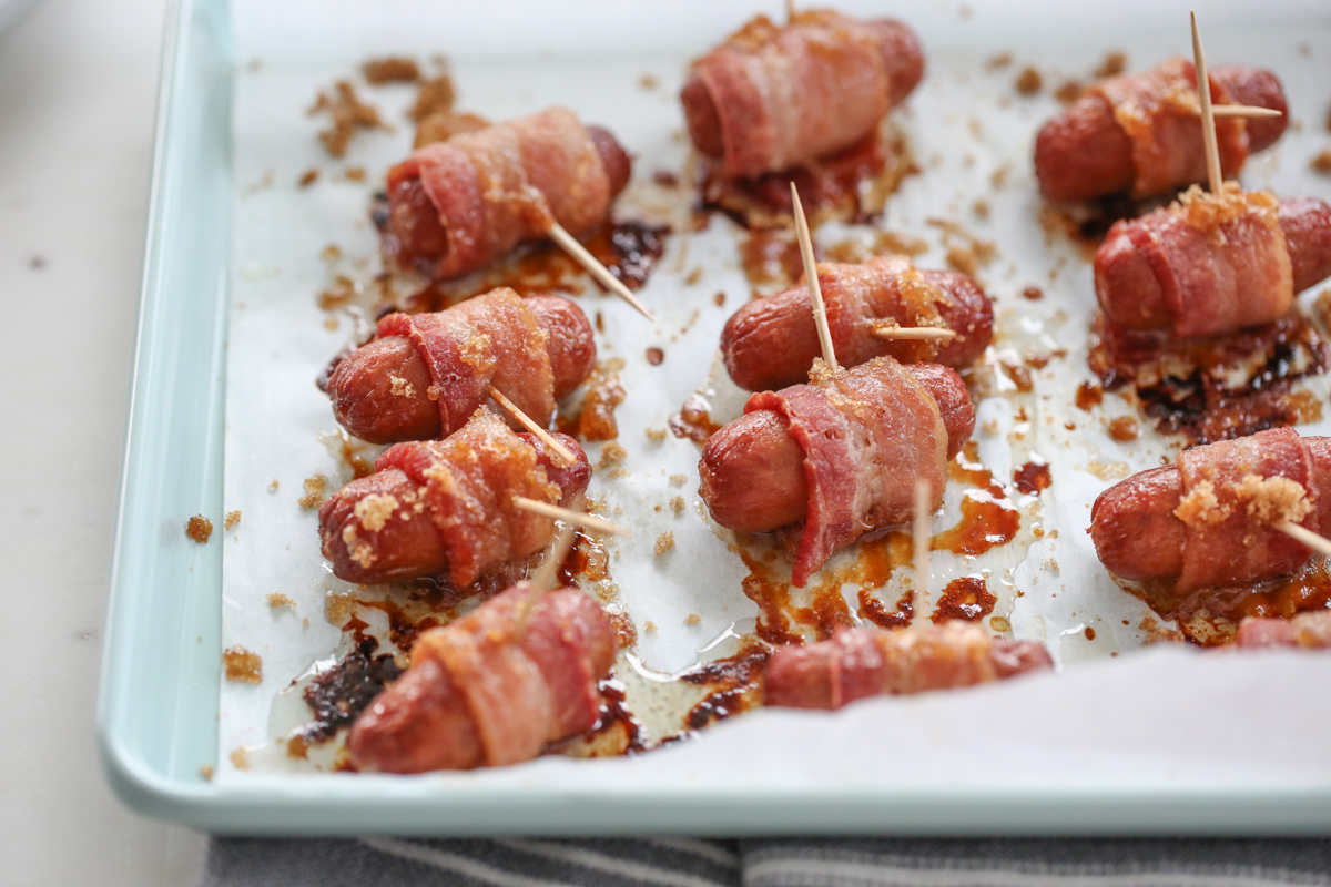 Bacon Wrapped Sausages on baking sheet