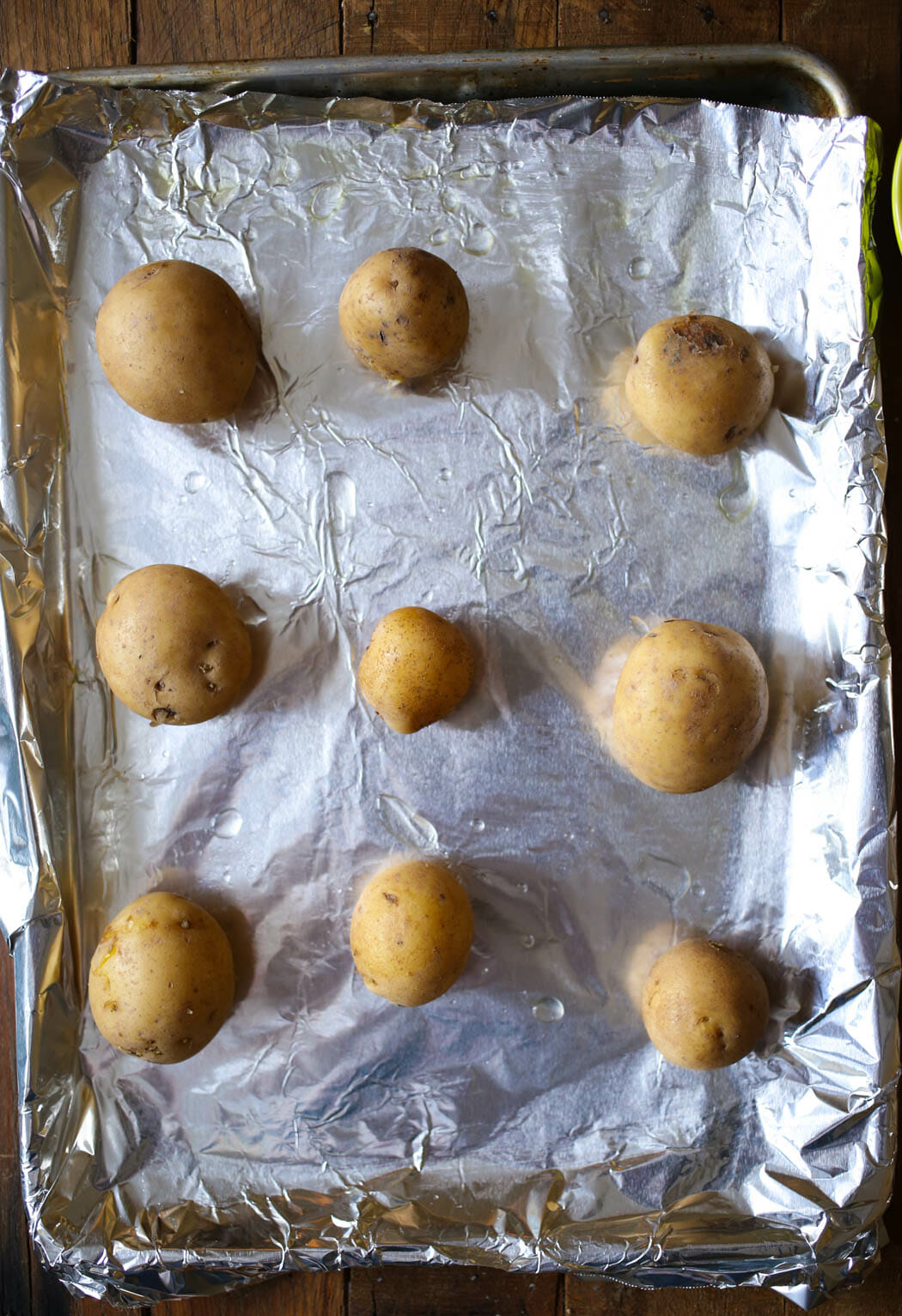 boiled potatoes on baking sheet #sidedish #potatoes #pesto